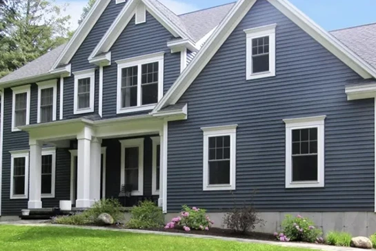 Blue house with white trim and columns on the porch.