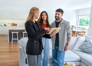 Real estate agent showing a couple a home. Buying a house.
