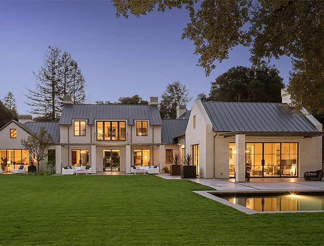 Luxury home with a large lawn and pool, showcasing high-end lease options.