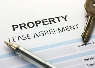 a piece of paper and sign of property lease agreement